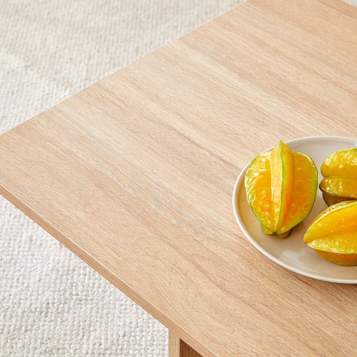 A wood colored coffee table.