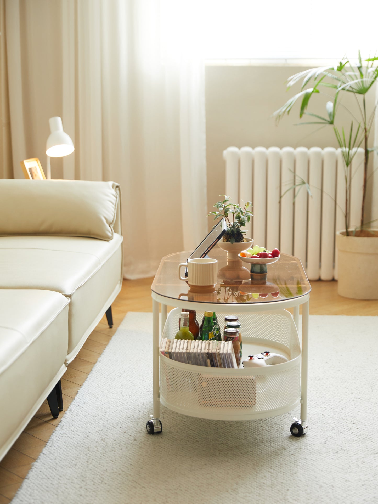 Movable oval metal glass coffee table with storage