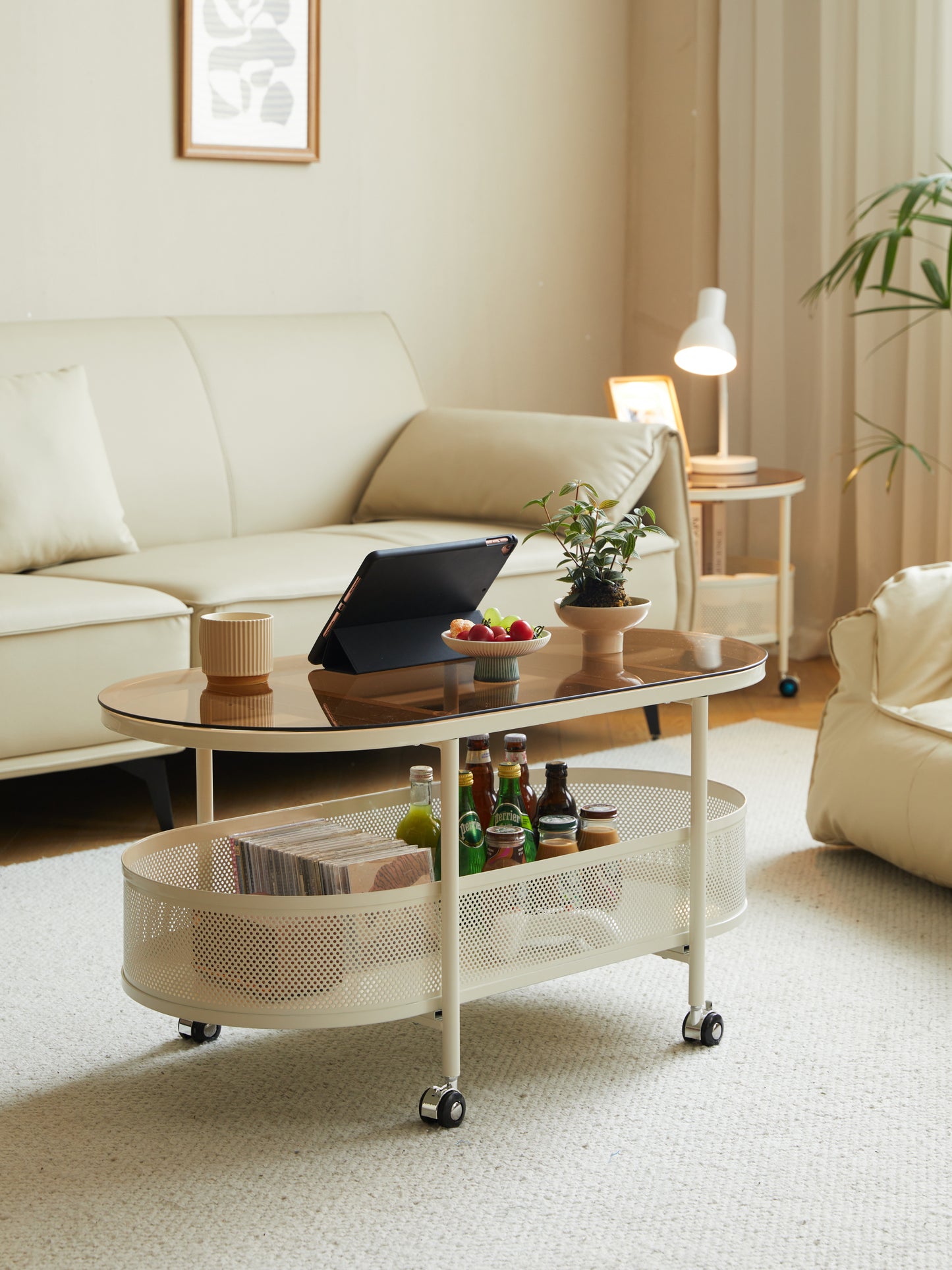 Movable oval metal glass coffee table with storage