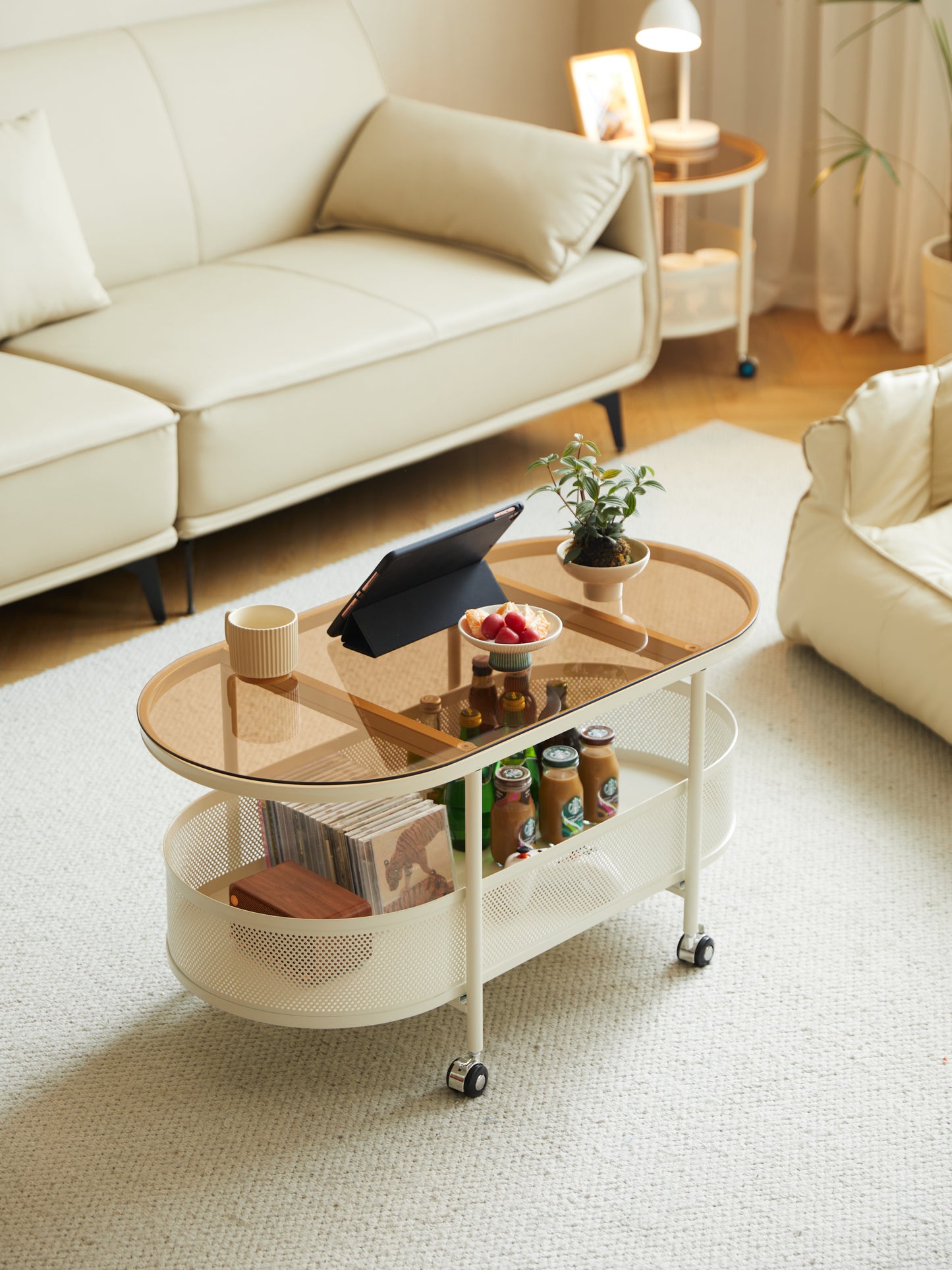 Movable oval metal glass coffee table with storage